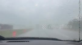 Blinding rain and mist cover windshield during storm in Jacksonburg, Indiana