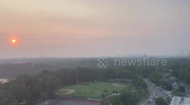 US: Misty Sunrise Over Fresh Pond in Cambridge