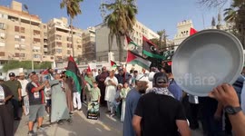 Libyans gather in front of Egyptian embassy in Tripoli demanding aid passage to Gaza
