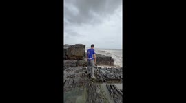 Man attempts beach stunt but gets swept by strong wave in Baga Beach, Baga, India