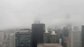 Dense mist blankets city skyline in Chicago, Illinois, USA
