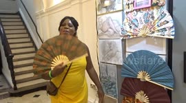 Fan artist Victoria Ajoku greets first visitors at Parallax Art Fair 39th edition in Chelsea Town Hall