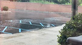 Steady rainfall soaks parking area in Fairfield, New Jersey