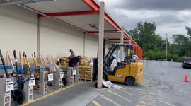 Home Depot workers loading bags of cement in Bennington Vermont