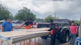 Home Depot Workers loading a pickup truck in front of the store