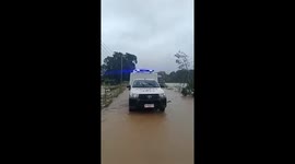 Locals wade through flooded roads from Typhoon Co-may impact in Philippines