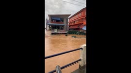 Floods surge through town covering first floor of shops in northern Thailand
