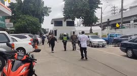 Police arrive at tourist market where gunman killed five in Bangkok
