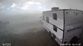 Tornado pushes caravan as vehicle is engulfed by dust