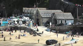 Harbour visitors make way for RNLI Lifeboat launch, Injured woman, multi agency cliff rescue, Newquay, Cornwall, UK