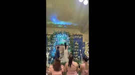 Bridesmaid catches bouquet then quickly throws it away