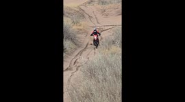 Motorbike rider crashes climbing uphill on sand in Monte Hermoso, Argentina