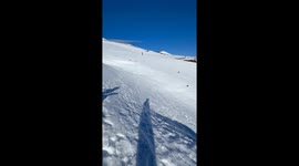 Skier falls during jump on snowy slope in Llaima, Chile