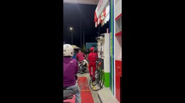 Gas station attendant startled by insect on collar in South Jakarta