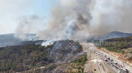 DRONE - Firefighting efforts continue to extinguish large wildfire in western Türkiye