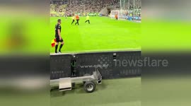 Climate extremist invades football pitch during game in Poland