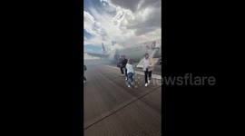 US: Passengers Flee Smoking Plane On Emergency Slides