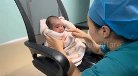 Pouting baby reacts to playful scolding in Henan, China