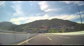 Dashcam captures rear-end collision before tunnel in Zhejiang, China