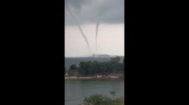 Stunning twin waterspouts seen off the coast of Indonesia