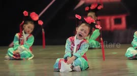 Little girl cries while taking part in traditional Chinese performance