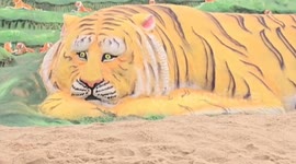 India: Sand Artist created a beautiful Majestic Sand Tiger Roars on Puri Beach for International Tiger Day
