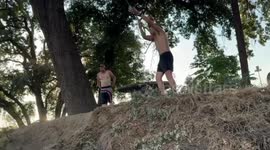 Man misses water landing and hits bench in rope swing mishap in in Laton, California, USA