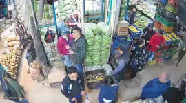 Crate-carrying mishap in busy market in Bogotá, Colombia