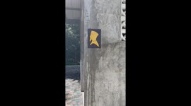 Muslim-style toilet signs have woman in hijab and man in songkok
