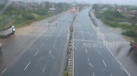 Mahindra car spins out of control and narrowly misses motorbike