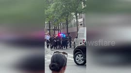 Police drag injured bystander to safety during New York shooting