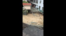 Severe floodwaters erode building foundations in Hubei, China