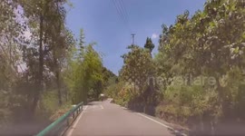 Dashcam captures head-on crash on winding road in Chongqing, China
