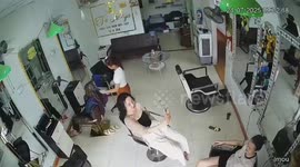 Woman spins off salon chair in playful mishap in Hanoi, Vietnam
