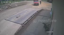 Bungling driver drops his load while mounting ramp