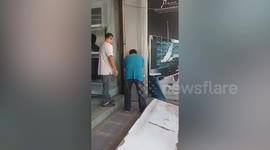 Cat stuck in wall rescued and adopted by kind workers