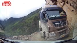 Terrifying moment rockfall of perilous mountain pass sends truck plummeting into gorge