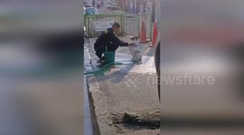 Heartwarming moment police officer bathes abandoned dog