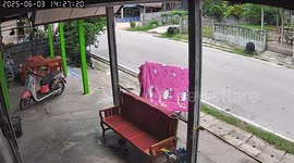 Passerby kindly adjusts duvet hanging from rack to help it dry