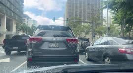Heavy traffic flows calmly out of downtown in Honolulu, Hawaii, USA