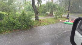 Florida Man Goes Tubing Down Rain-Drenched Street