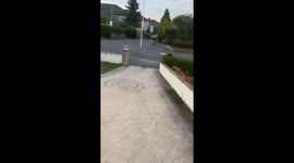 Police chase ends in yard collision and foot pursuit in Bradford, West Yorkshire, England, UK