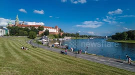 Time lapse of Wawel castle and Visla Vistula river with tourist boats in Krakow, Poland