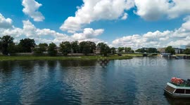 Time lapse of Visla Vistula river with tourist boats in Krakow, Poland