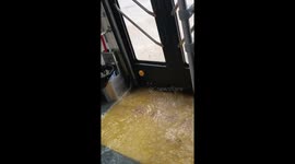 Floodwaters seep into bus manoeuvring through waterlogged roads