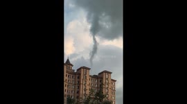 Funnel cloud resembling tornado spirals skyward in China