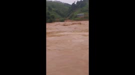 Flash flood destroys bridge, houses as it sweeps through village in Vietnam