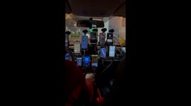 Taxi Driver With Eleven Phones On Windshield