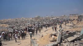 Hunger-stricken Palestinians rush to aid distribution point in Gaza for limited flour