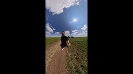 Man Nearly Hit by Giant Spraying Tractor Arm While Walking Through Field